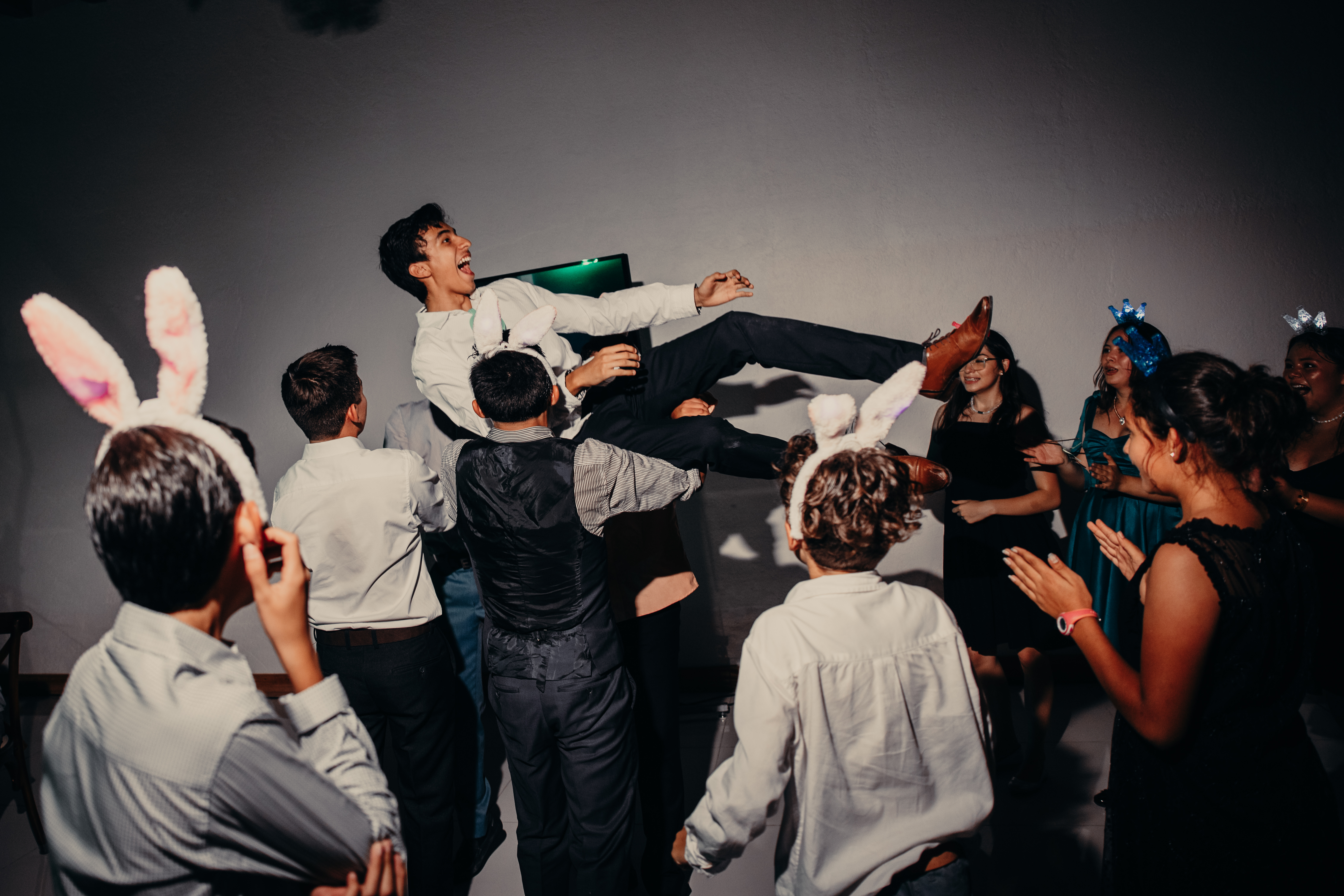 Me, Andres Bautista, being held up in the air at a party